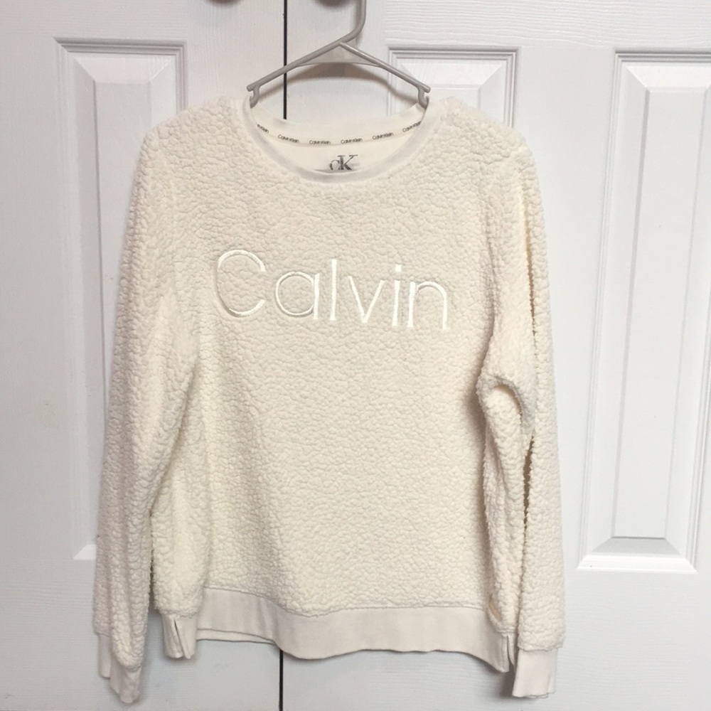 White, Calvin Klein sweater.